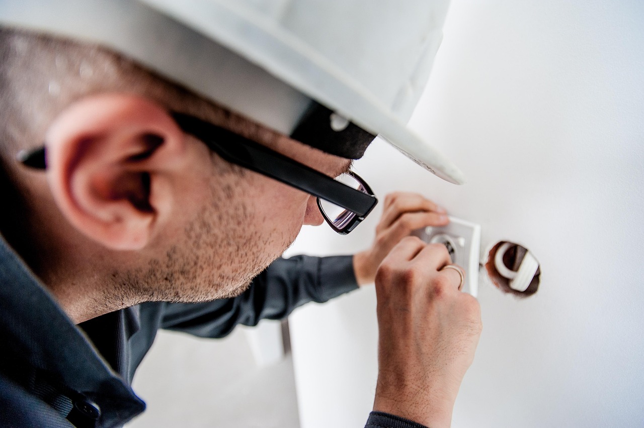 electrician installing residential electrical panel Regina